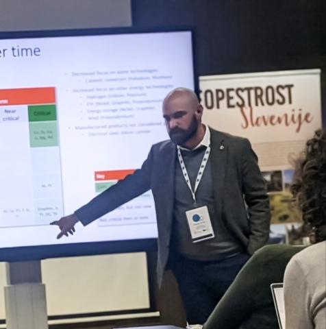 person pointing at a presentation screen