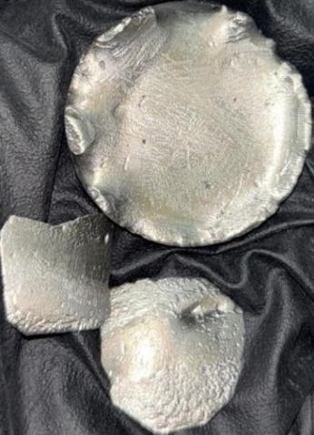 image of metal sample: About 55 g of Dysprosium metal obtained after calciothermic reduction of 100g of sodium dysprosium tetrafluoride (NaDyF4) compound.