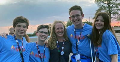 image of five people - four high school students and CMI teacher researcher Danielle Ladd (center)