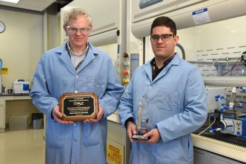 Two researchers hold awards