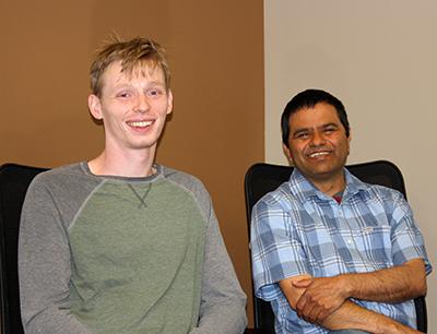 image of two people seated: CMI project lead Durga Paudyal (right) is mentoring Iowa State University doctoral student Gavin Nop (left) through the U.S. Department of Energy Office of Science Graduate Student Research (SCGSR) Award. 