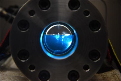 Solvent being loaded into a pressurized electrochemistry cell.