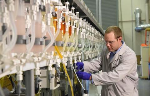 Kevin Lyon, an INL chemical engineer with expertise in applied solvent extraction, operates a counter-current solvent extraction system for testing and developing the process design for the separation technology.