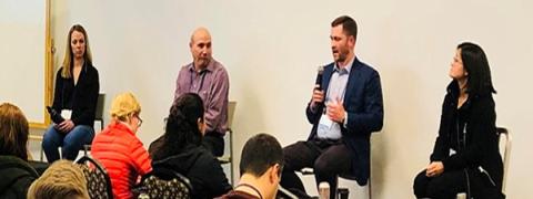 image of four people at front of a room -- CMI Director Tom Lograsso, Ames National Laboratory (second from left) was on a panel discussion with university and industry. 