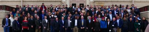 image of people standing on stairs are the CMI Winter Meeting attendees.