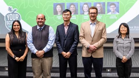 image of five people standing in a row: Your Science in a Nutshell winners Ana Belen Cueva (People’s Choice, right)