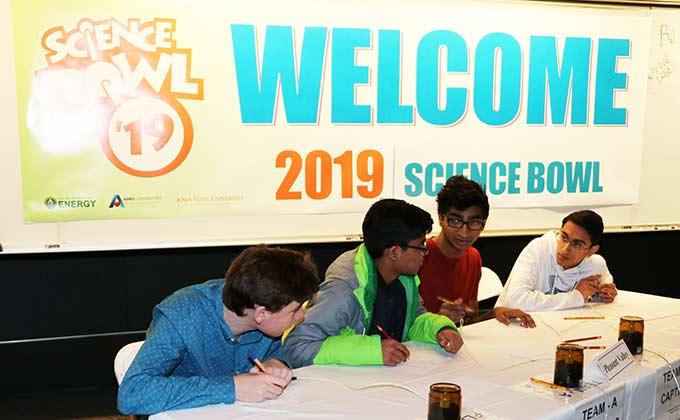 Team members confer during the 2019 Ames Laboratory High School Science Bowl