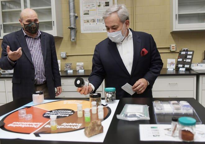 Des Moines Register report on the U.S. Secretary of Energy visit to Ames Laboratory: CMI Director Tom Lograsso (left) describes the award winning, patented acid-free dissolution process developed by CMI researchers to U.S. Secretary of Energy Dan Brouillette, who looks at sample of shredded hard disk drive in the CAMPS laboratory.