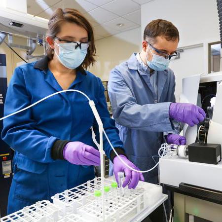 Santa Jansone-Popova, left, and Ilja Popovs quantify rare-earth element concentrations in liquid samples using a spectroscopy instrument. Credit: Genevieve Martin/ORNL, U.S. Dept. of Energy