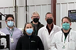 scientists stand in a research laboratory
