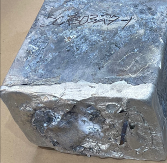 Image of metal cube that is part of a CMI Hub process to refine powder and reduce it to a metal.