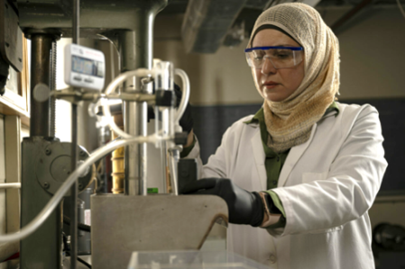 image of person standing with laboratory equipment