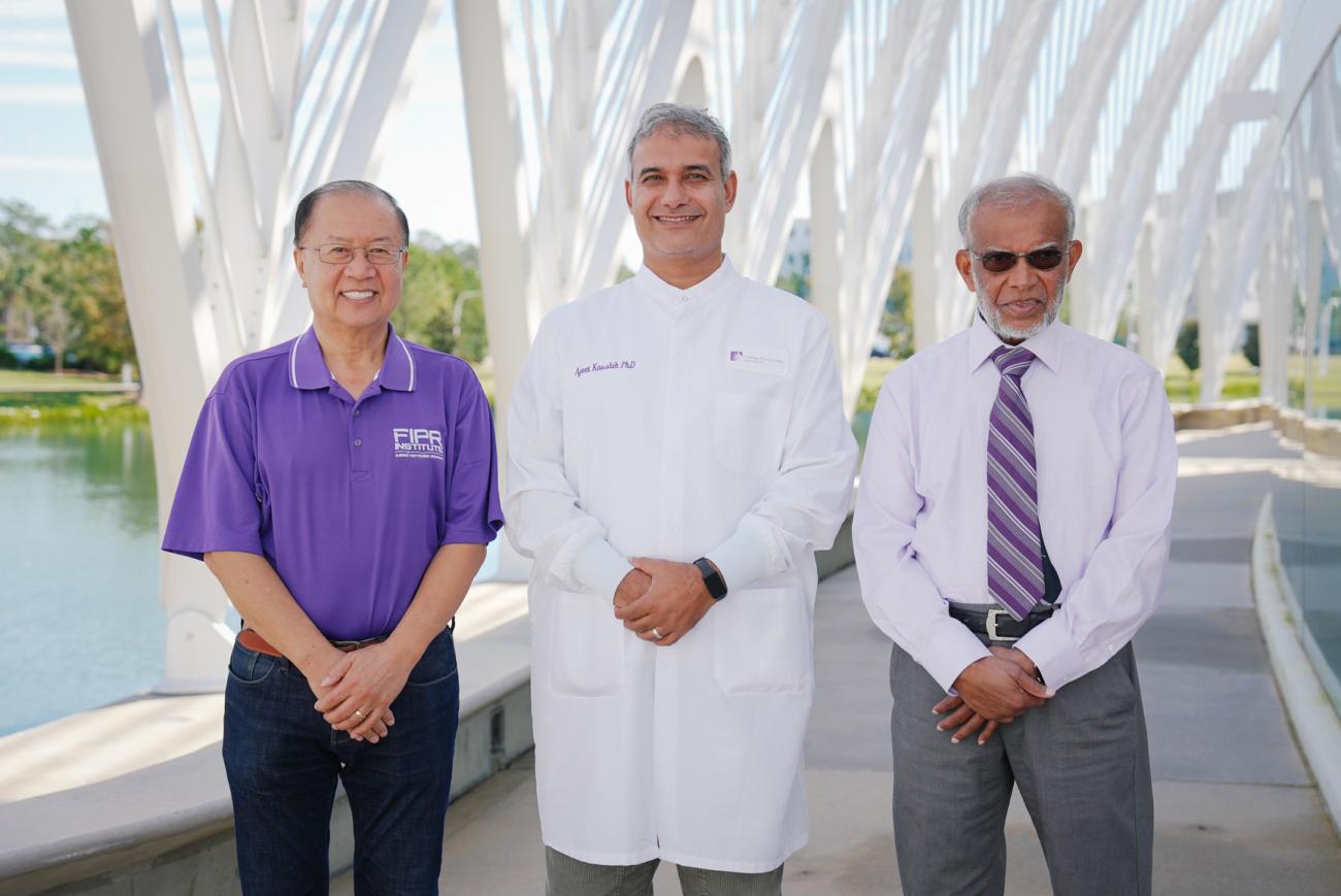 image of three people standing -- on right is CMI project lead Patrick Zhang