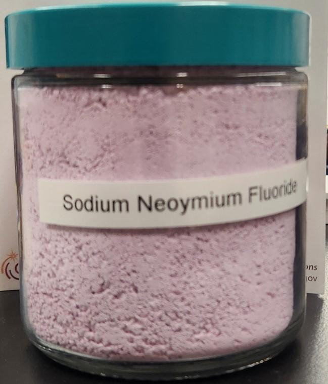 image of vial of pink powder labeled sodium neodymium fluoride