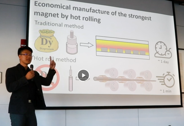 image of person standing in front of screen with projection of research slide