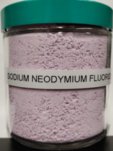 image of vial of pink powder labeled sodium neodymium fluoride