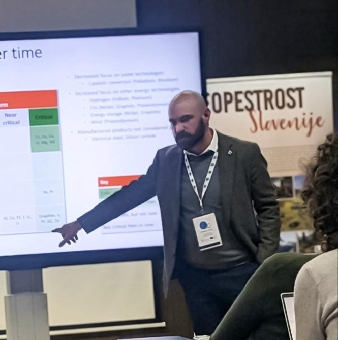 person pointing at presentation screen