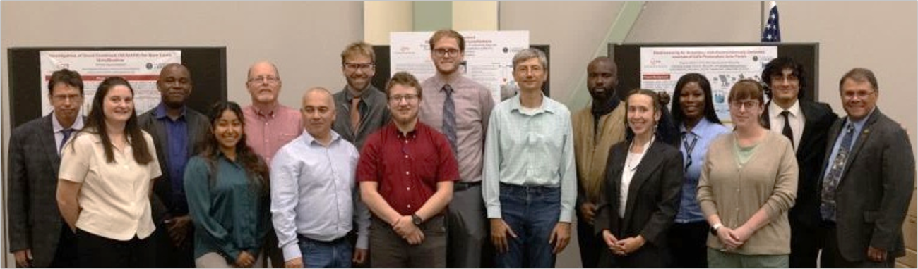 group of people standing by research posters