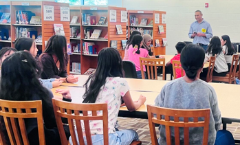CMI Leadership Academy member, Gaurav Das, OLI Systems, (shown top right) presents to middle school students