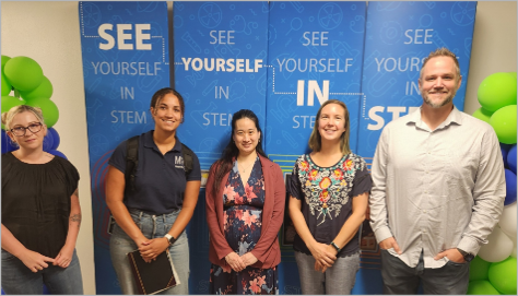 five people standing: CMI Leadership Academy member Chloe Tolbert, Idaho National Laboratory (shown left), served on a panel discussion to raise awareness of critical materials and STEM careers. 