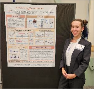 person standing by a research poster:  CMI Intern Aubrey Lemer, Oak Ridge National Laboratory,  at 2025 CMI Annual Meeting. 