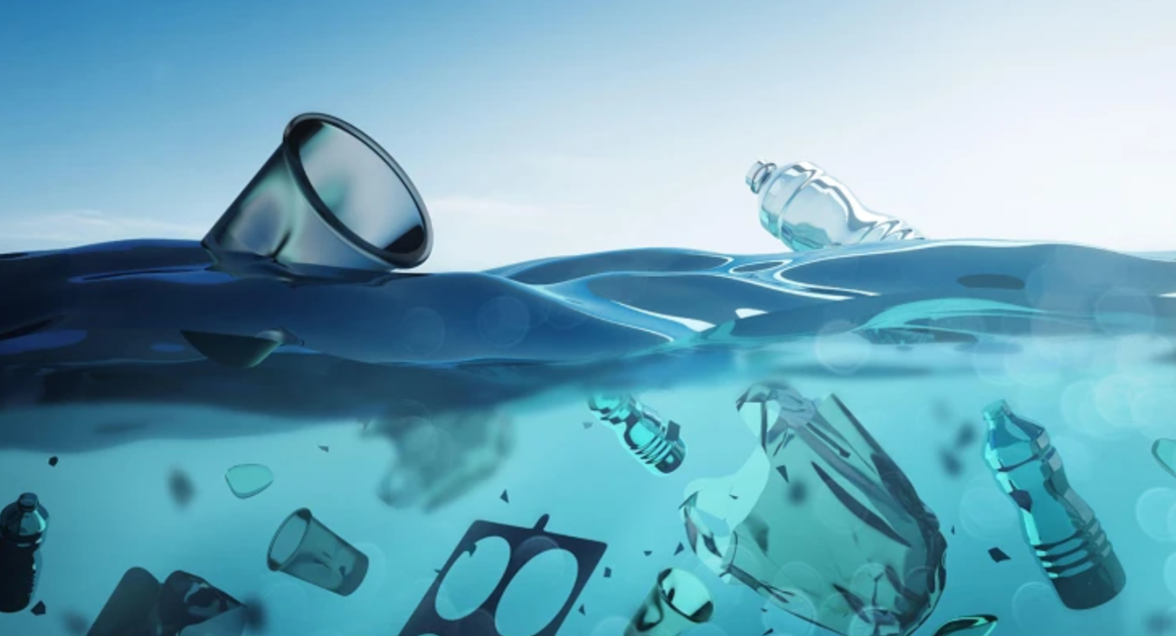 Stock image of plastic waste floating in a large body of water