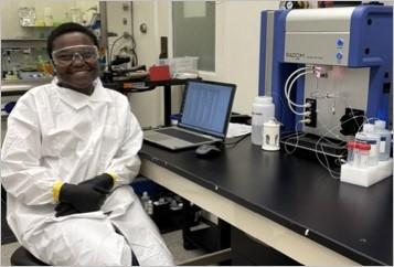 CMI intern Rutendo Barara in research lab, analyzing samples
