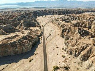 aerial photograph of highway through a canyon