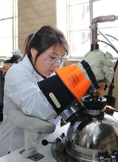 Researcher prepares a caloric material sample